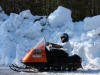 Jed on snowmobile down at cabin 7